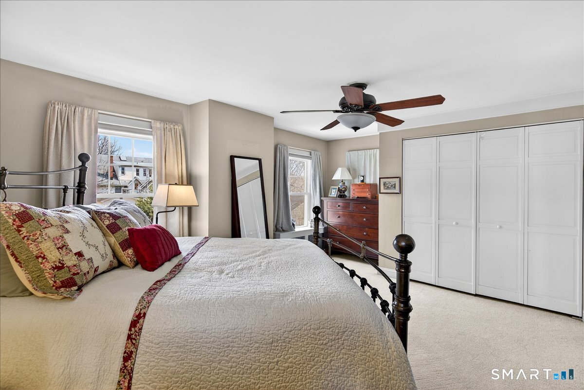 95 Clark Street New Haven, CT 06511 - Photo 22 of 39 a bedroom with a bed and a chandelier