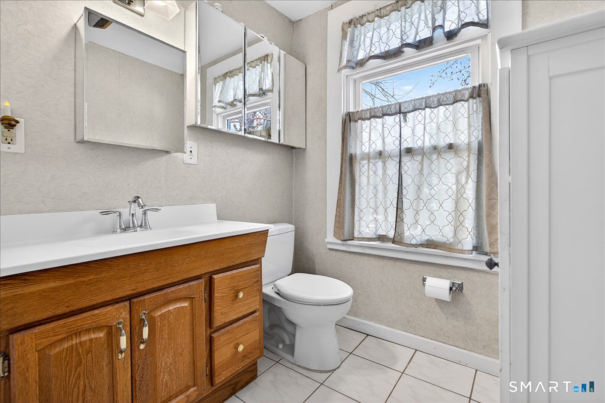 95 Clark Street New Haven, CT 06511 - Photo 23 of 39 a bathroom with a sink toilet and a window