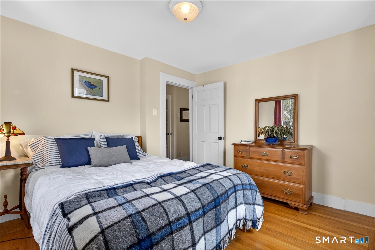 95 Clark Street New Haven, CT 06511 - Photo 30 of 39 a bedroom with a bed and a lamp on dresser