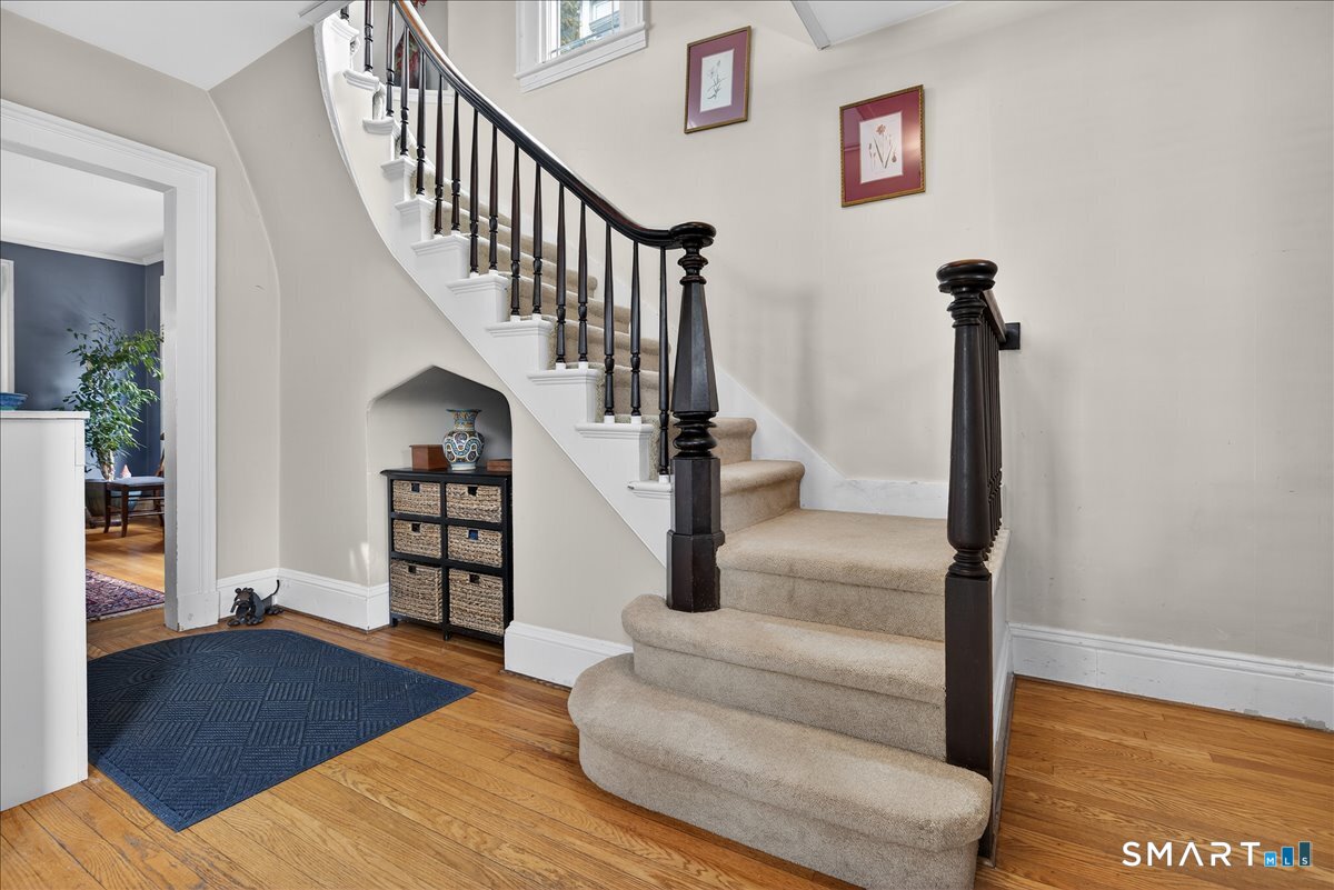 95 Clark Street New Haven, CT 06511 - Photo 3 of 39 a view of staircase with wooden floor and a rug