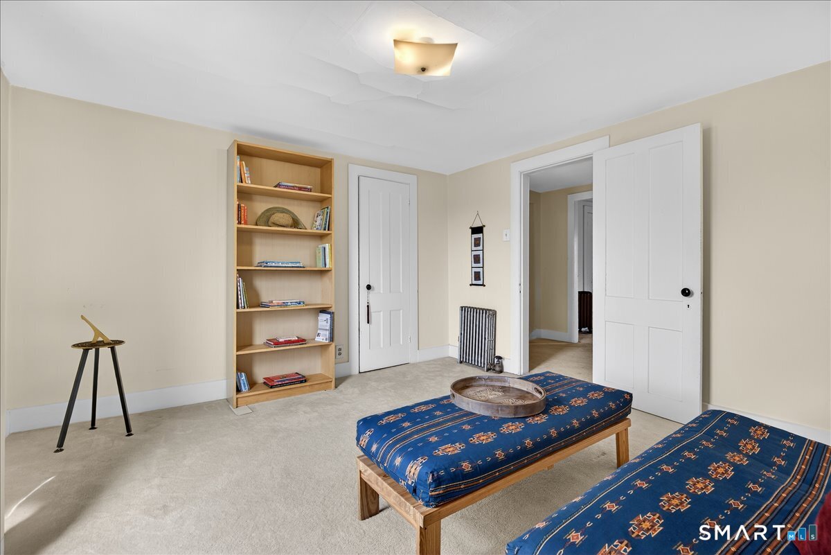 95 Clark Street New Haven, CT 06511 - Photo 32 of 39 a living room with a bed and a lamp with wooden floor