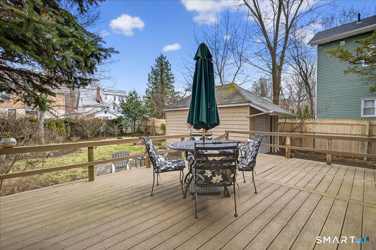 95 Clark Street New Haven, CT 06511 - Photo 33 of 39 a view of a roof deck with table and chairs floor to ceiling with wooden floor