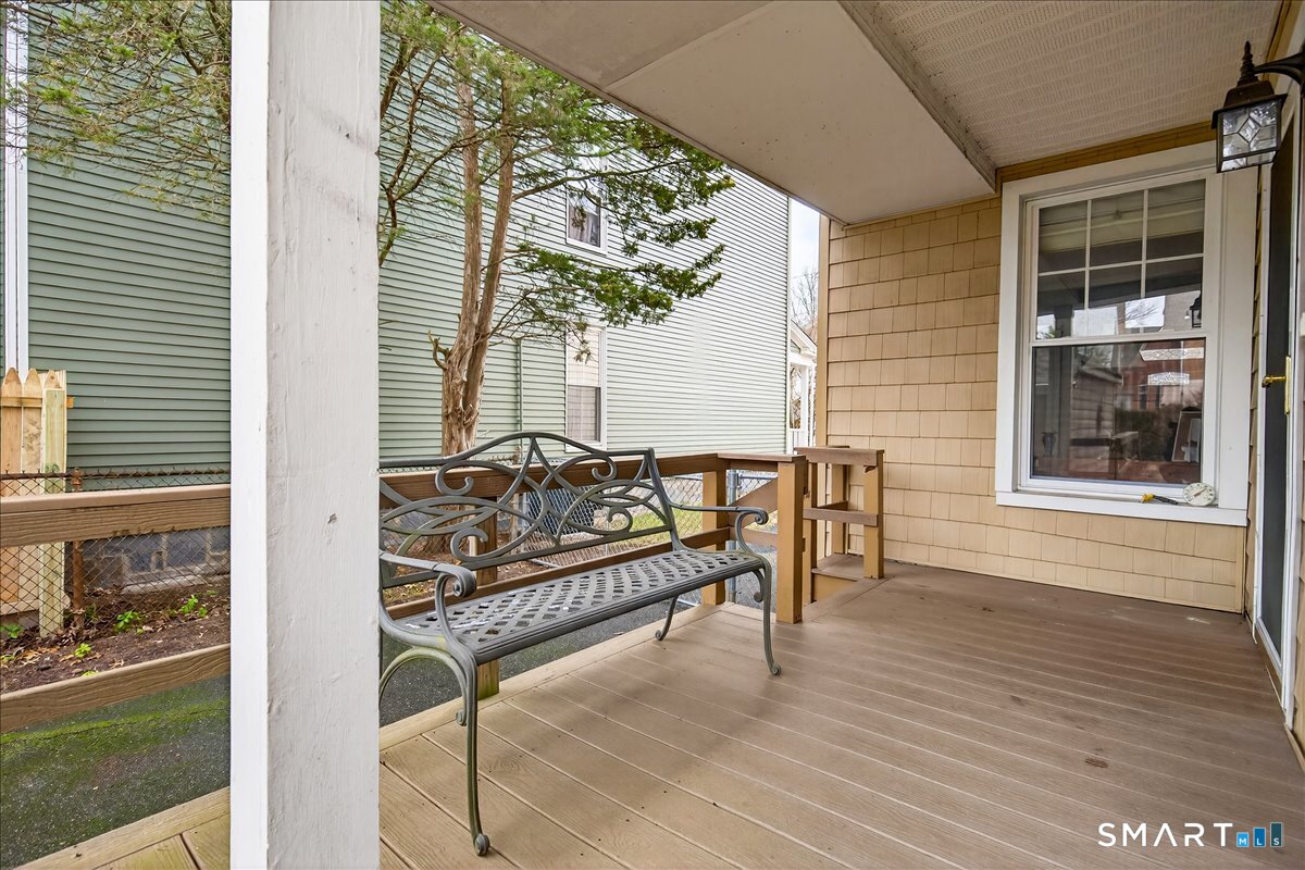 95 Clark Street New Haven, CT 06511 - Photo 34 of 39 a balcony with table and chairs and wooden floor