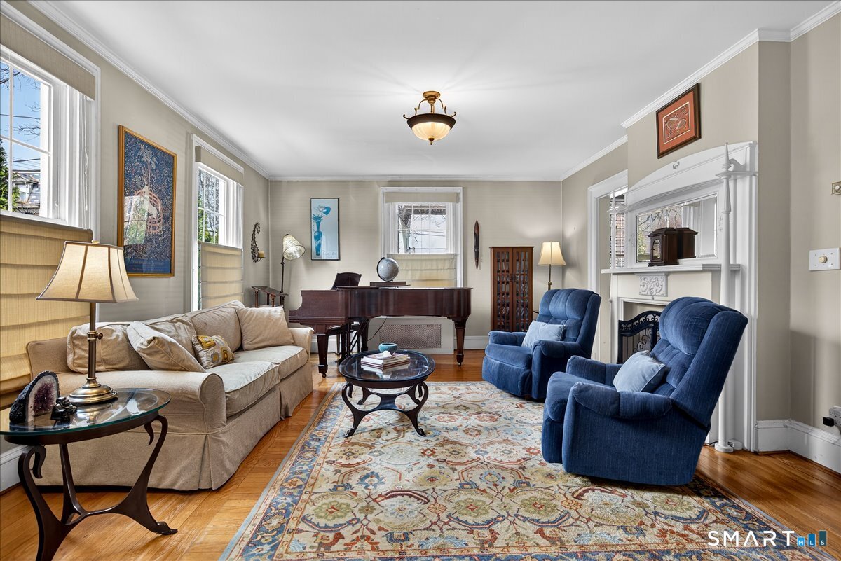 95 Clark Street New Haven, CT 06511 - Photo 5 of 39 a living room with furniture ceiling fan and a rug