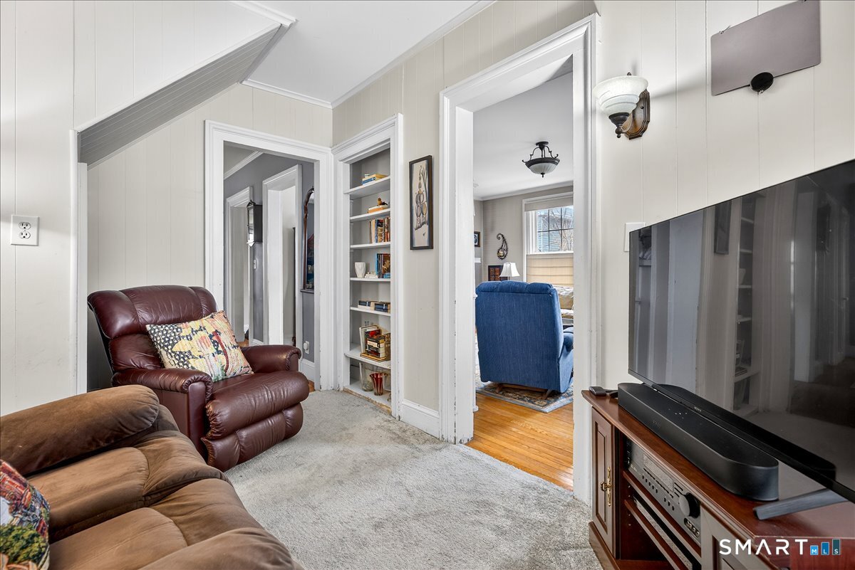 95 Clark Street New Haven, CT 06511 - Photo 10 of 39 a living room with furniture and a gate