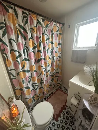 a bathroom with a sink toilet and a mirror