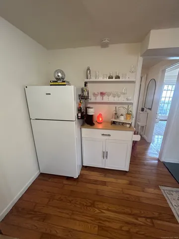 a view of kitchen with wooden floor