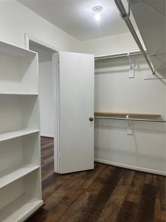 a view of an empty walk in closet