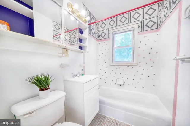 a bathroom with a toilet sink and bathtub