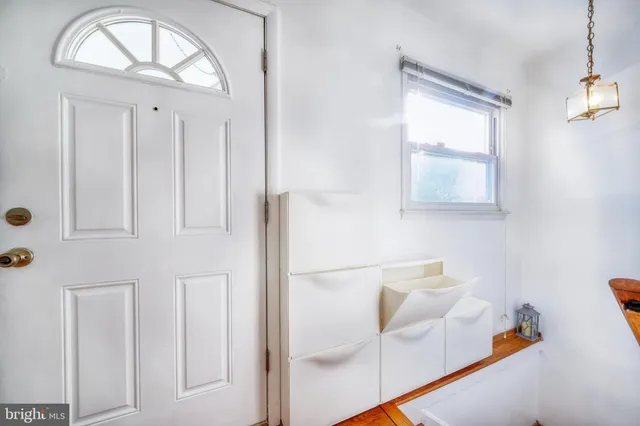 a bathroom with a bathtub and a window