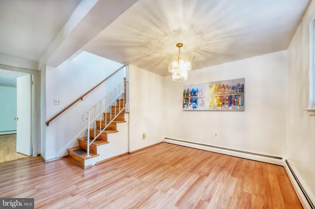 a view of an entryway with wooden floor
