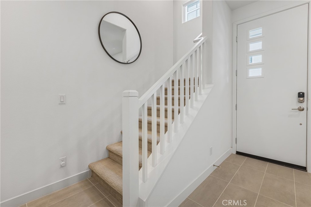 285 Lodestar Tustin, CA 92782 - Photo 11 of 40 a view of a livingroom with wooden floor and entryway