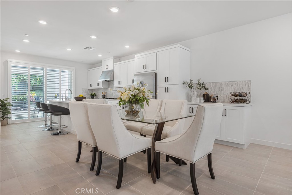 285 Lodestar Tustin, CA 92782 - Photo 19 of 40 a dining room with furniture and window