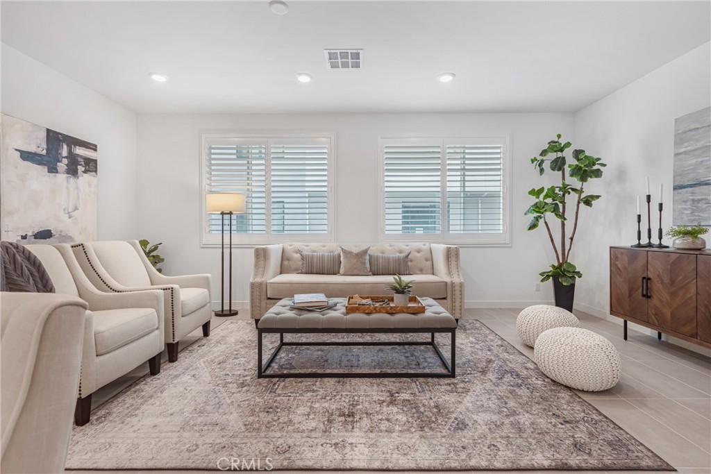 285 Lodestar Tustin, CA 92782 - Photo 20 of 40 a living room with furniture and a potted plant