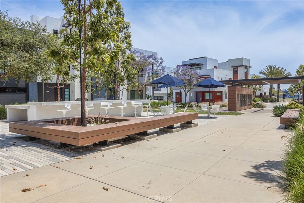 285 Lodestar Tustin, CA 92782 - Photo 38 of 40 a view of a building with a garden and sitting area