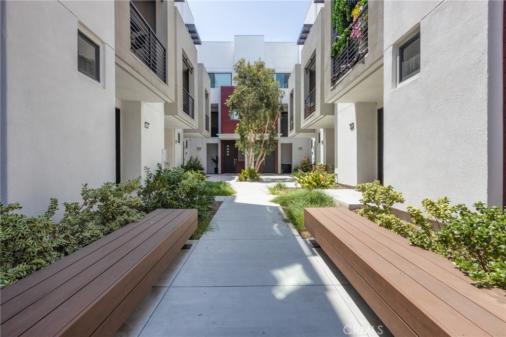 285 Lodestar Tustin, CA 92782 - Photo 7 of 40 a view of a pathway both side of the house