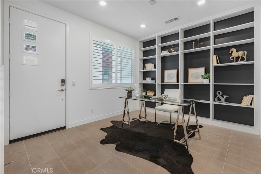 285 Lodestar Tustin, CA 92782 - Photo 10 of 40 a view of a livingroom with workspace and a window