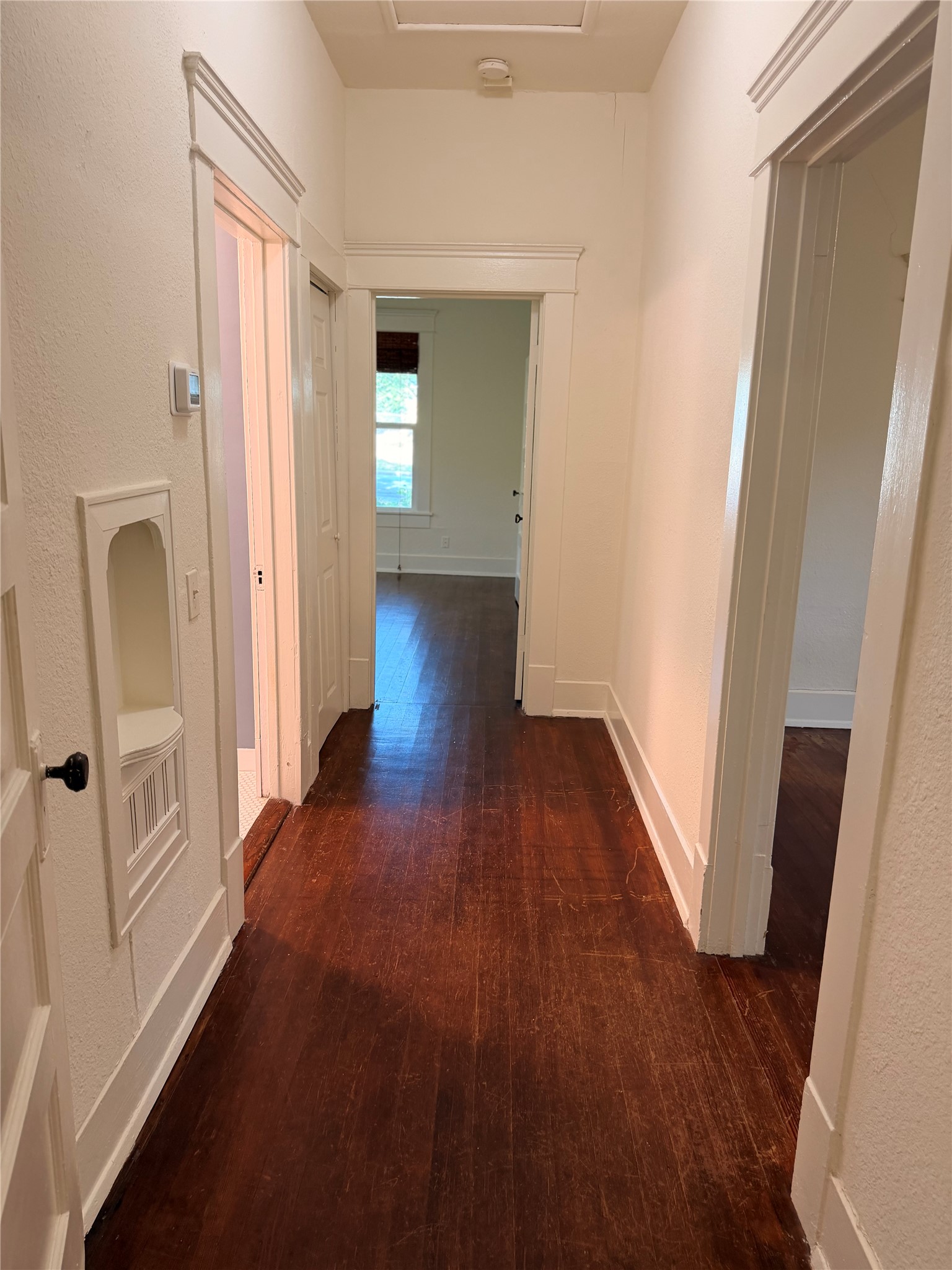 1136 Eleanor Street Austin, TX 78721 - Photo 19 of 30 Rich hardwood floors welcome you into this inviting hallway.