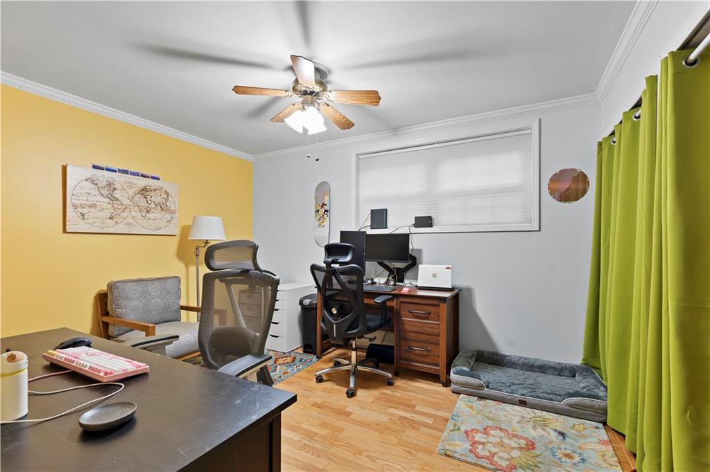 5400 Roswell Road, Unit L6 Sandy Springs, GA 30342 - Photo 11 of 19 a view of workspace with wooden floor windows gym equipment and windows