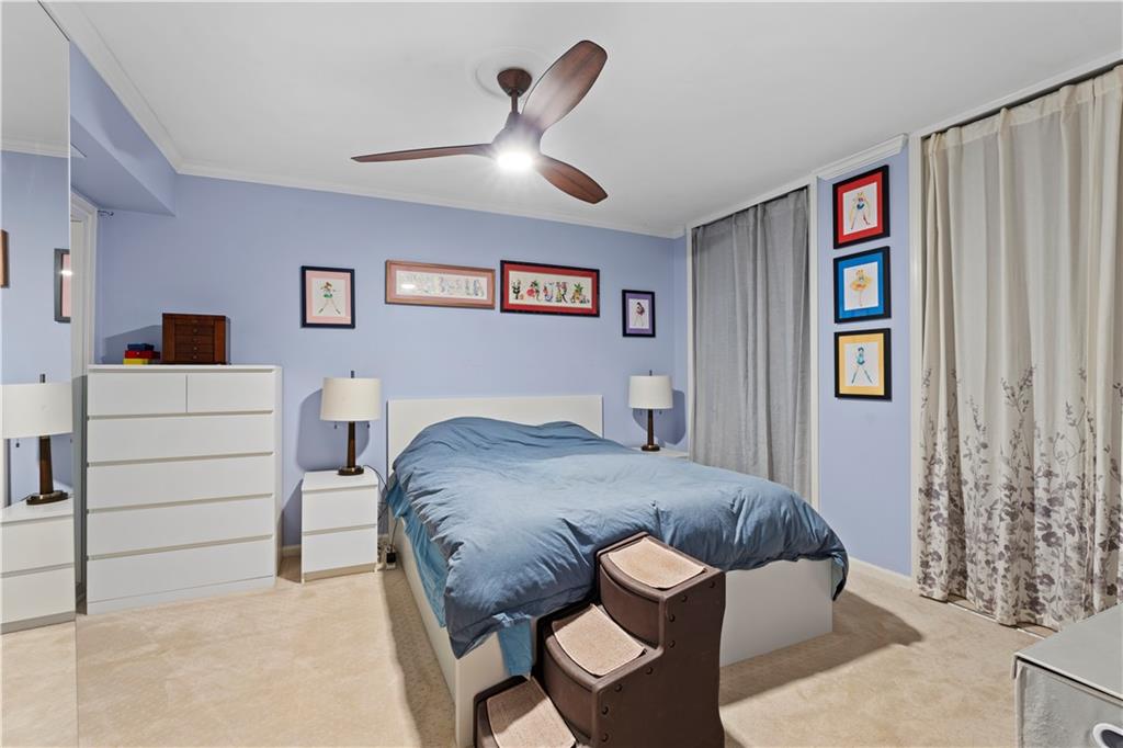 5400 Roswell Road, Unit L6 Sandy Springs, GA 30342 - Photo 13 of 19 a bedroom with a bed and a cabinets