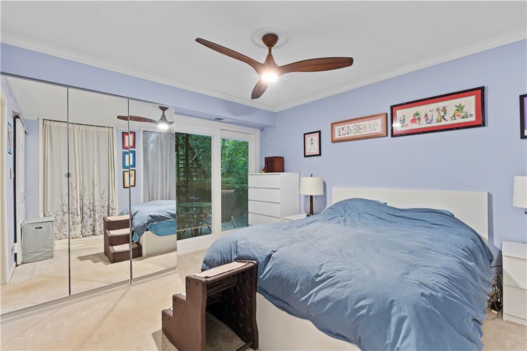 5400 Roswell Road, Unit L6 Sandy Springs, GA 30342 - Photo 15 of 19 a bedroom with a large bed and a large window