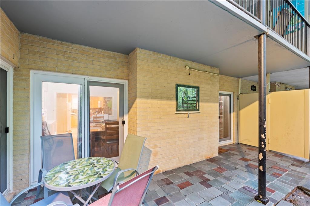 5400 Roswell Road, Unit L6 Sandy Springs, GA 30342 - Photo 19 of 19 a view of a hallway with wooden floor and furniture