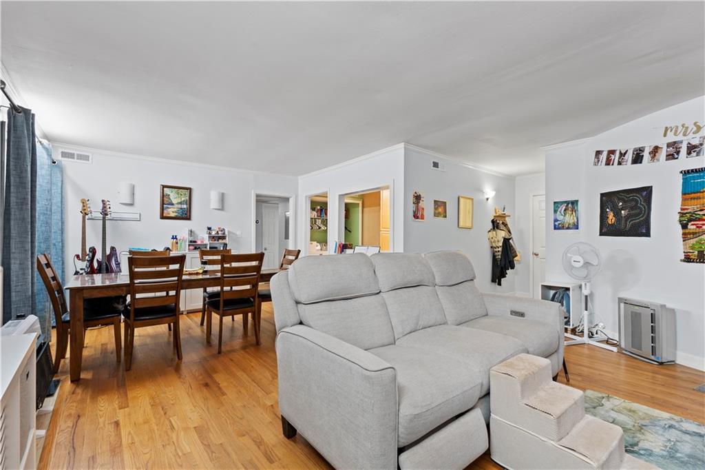 5400 Roswell Road, Unit L6 Sandy Springs, GA 30342 - Photo 7 of 19 a living room with furniture and wooden floor