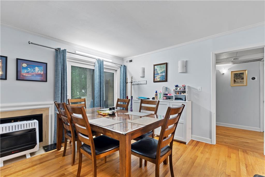 5400 Roswell Road, Unit L6 Sandy Springs, GA 30342 - Photo 8 of 19 a view of a dining room with furniture window and wooden floor