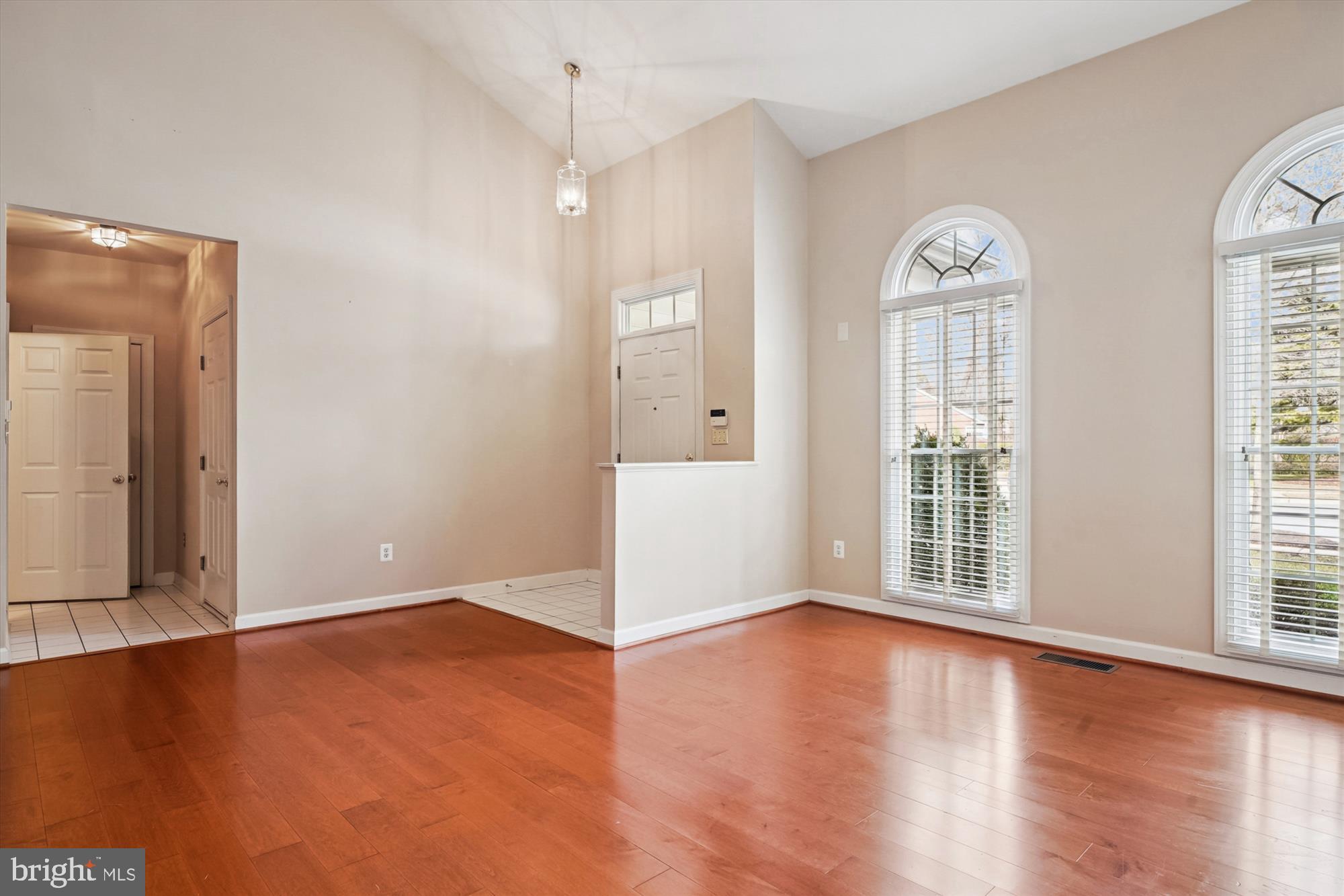328 Colony Point Place Edgewater, MD 21037 - Photo 11 of 89 an empty room with wooden floor and windows