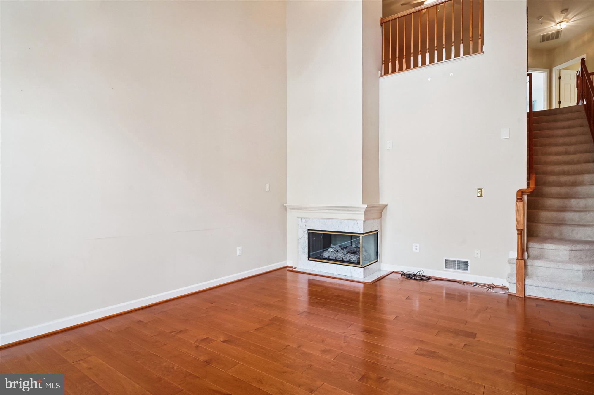 328 Colony Point Place Edgewater, MD 21037 - Photo 13 of 89 a view of empty room with wooden floor and fireplace