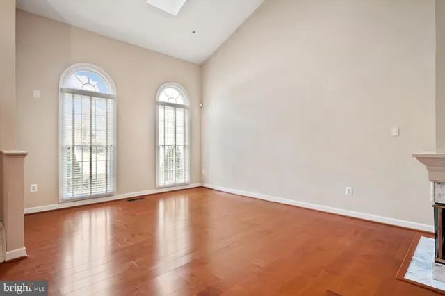 a view of a kitchen with a sink stainless steel appliances and cabinets