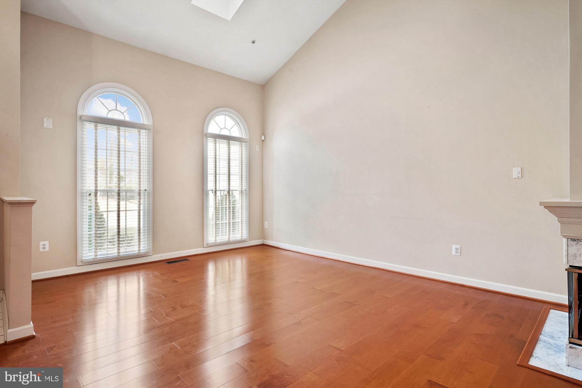 328 Colony Point Place Edgewater, MD 21037 - Photo 14 of 89 an empty room with wooden floor and windows