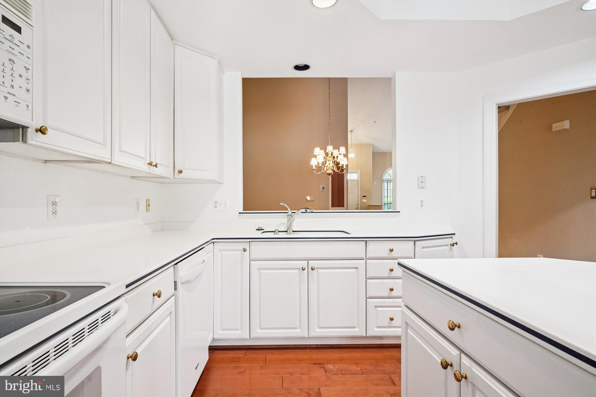 328 Colony Point Place Edgewater, MD 21037 - Photo 18 of 89 a kitchen with white cabinets and sink