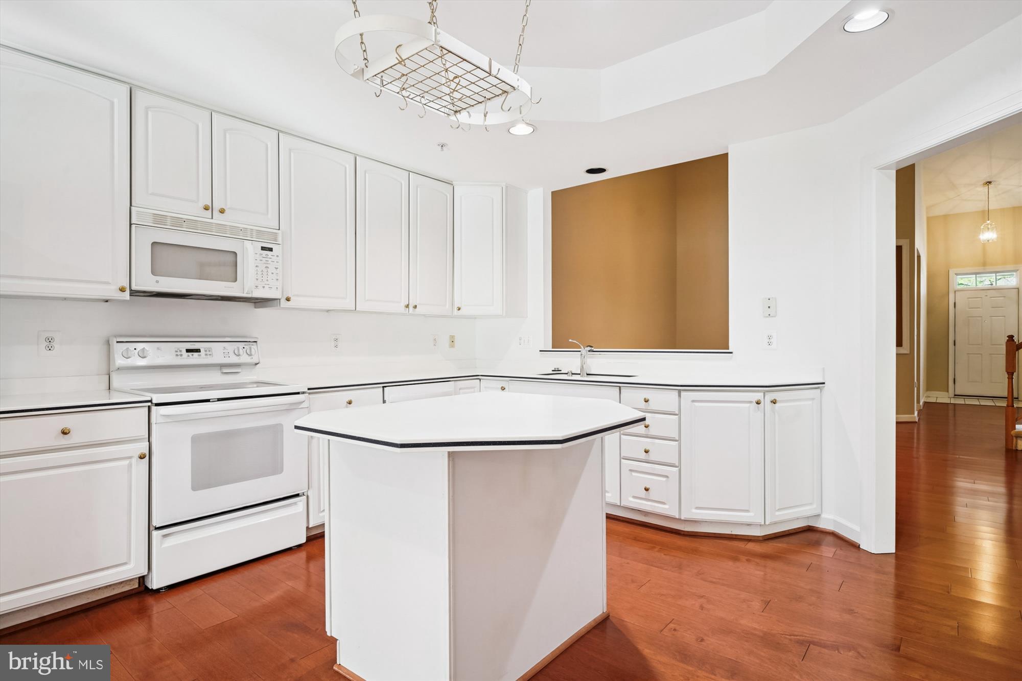 328 Colony Point Place Edgewater, MD 21037 - Photo 20 of 89 a kitchen with white cabinets appliances and a center island