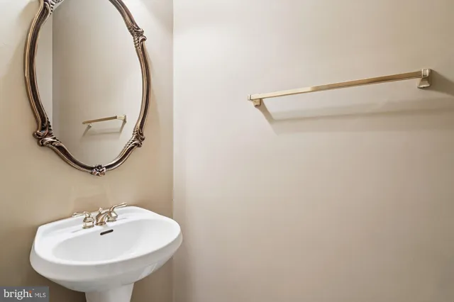 an empty room with a chandelier fan