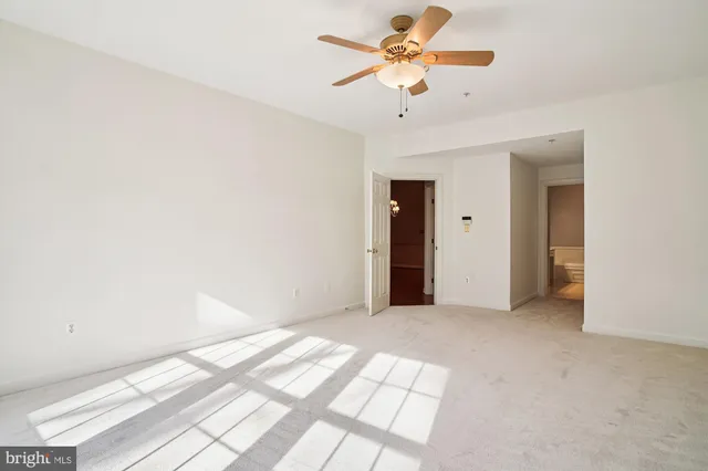 an empty room with a empty space and windows