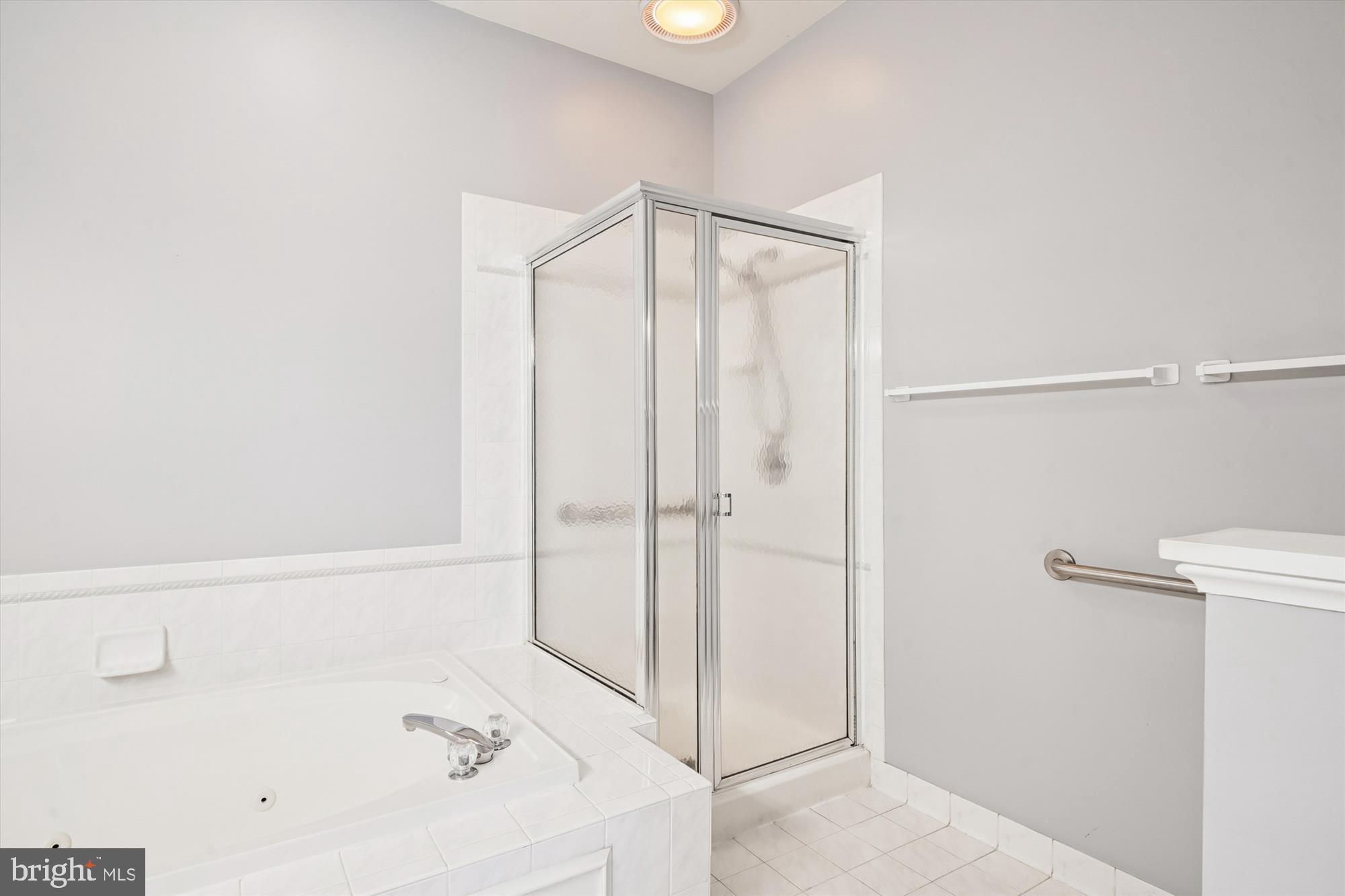 328 Colony Point Place Edgewater, MD 21037 - Photo 39 of 89 a bathroom with a bathtub and a shower
