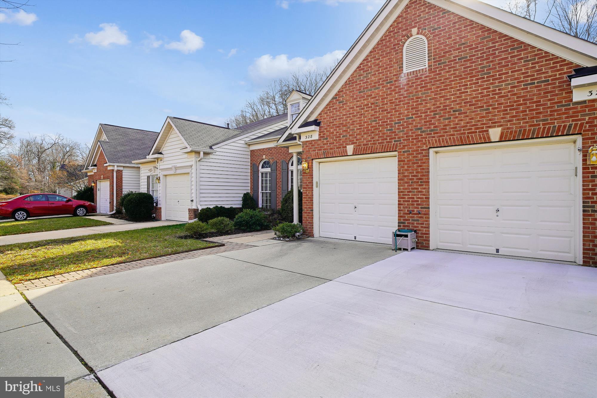 328 Colony Point Place Edgewater, MD 21037 - Photo 4 of 89 a front view of a house with a yard and garage