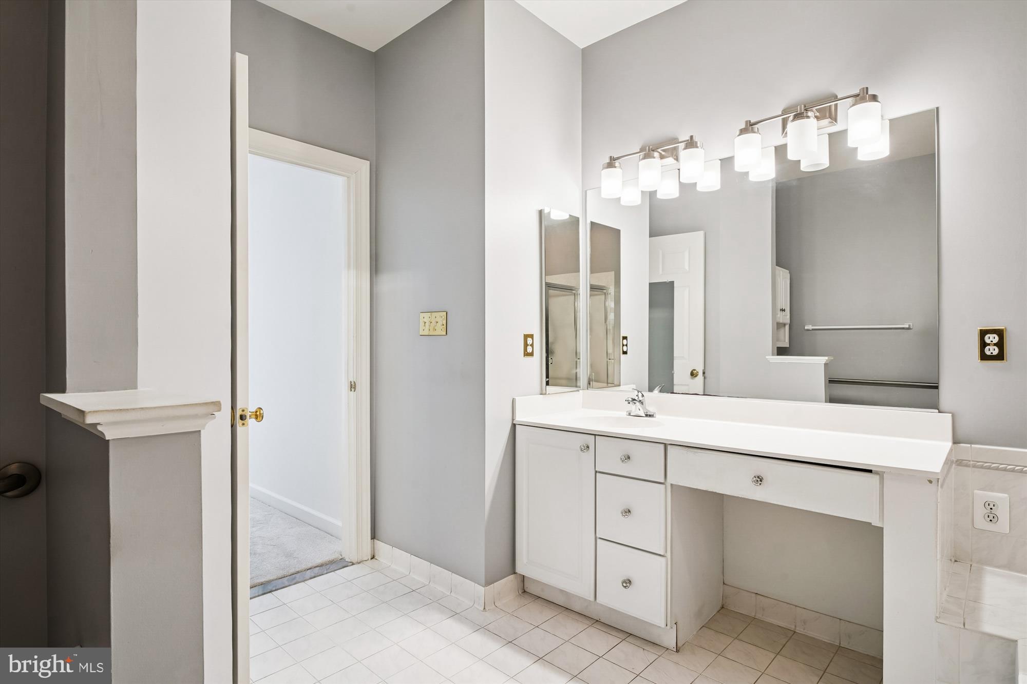 328 Colony Point Place Edgewater, MD 21037 - Photo 42 of 89 a spacious bathroom with a double vanity sink and a mirror