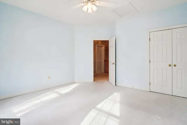 a backyard of a house with lots of green space and fountain