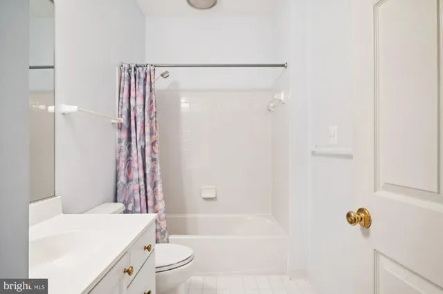 a sign board with a play ground in the back