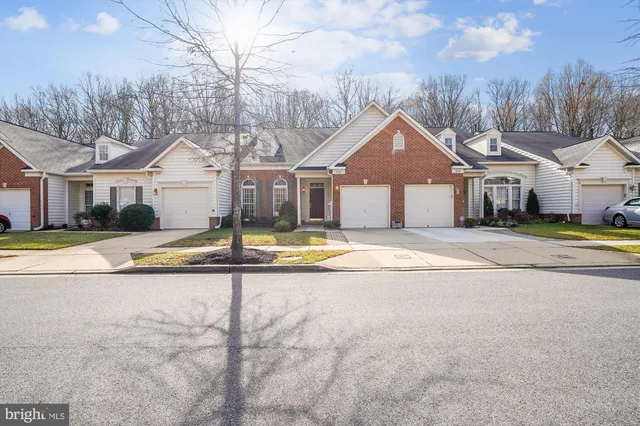 a view of empty room with wooden floor and fireplace