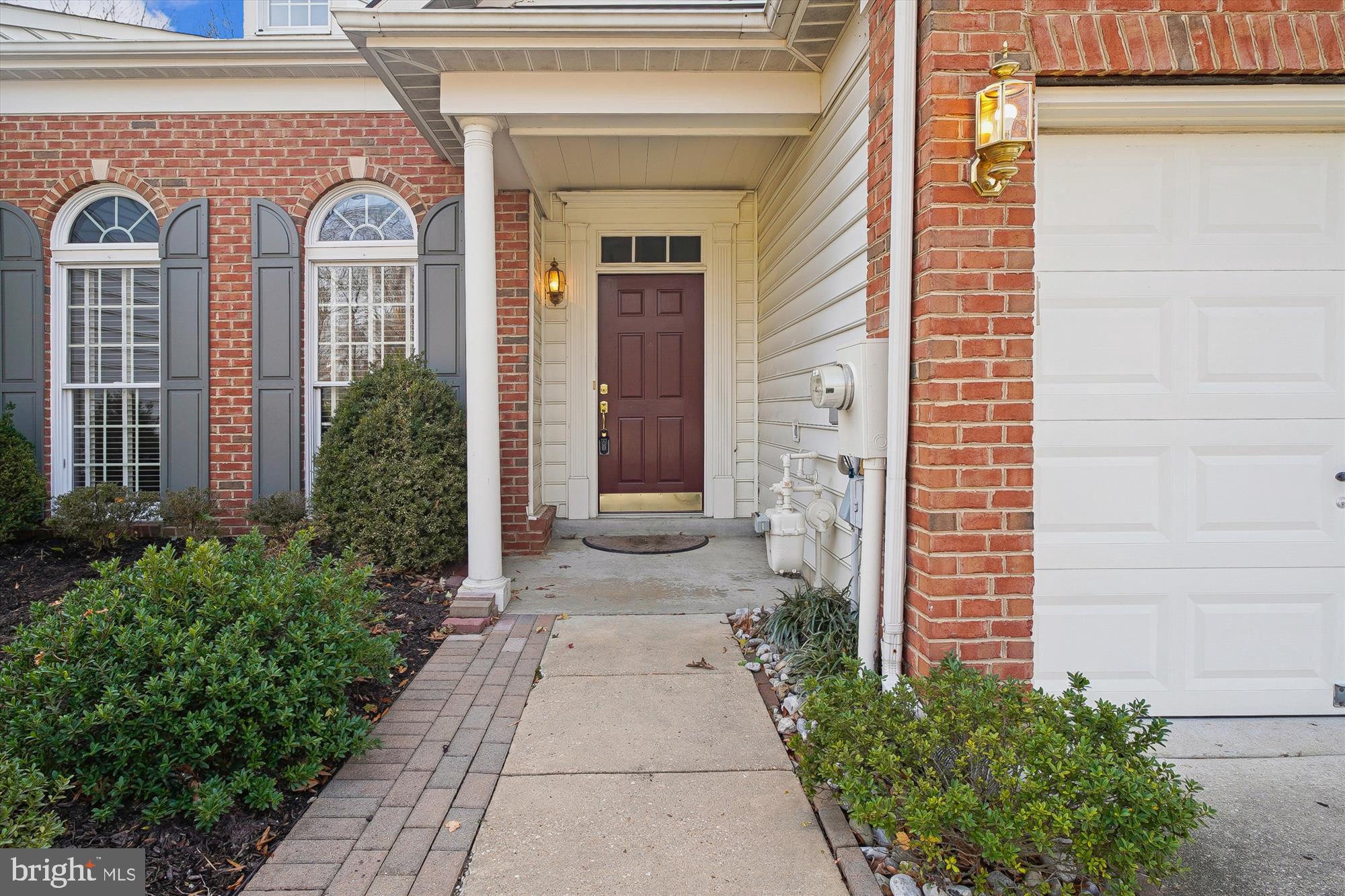 328 Colony Point Place Edgewater, MD 21037 - Photo 8 of 89 a front view of a house with a garden