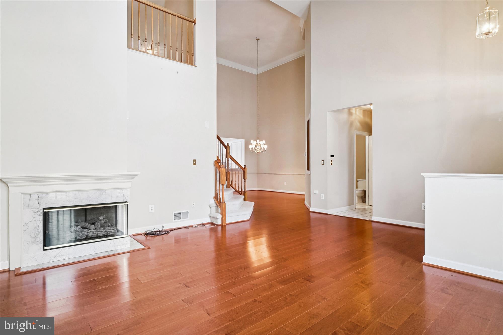 328 Colony Point Place Edgewater, MD 21037 - Photo 10 of 89 a view of empty room with wooden floor and fireplace