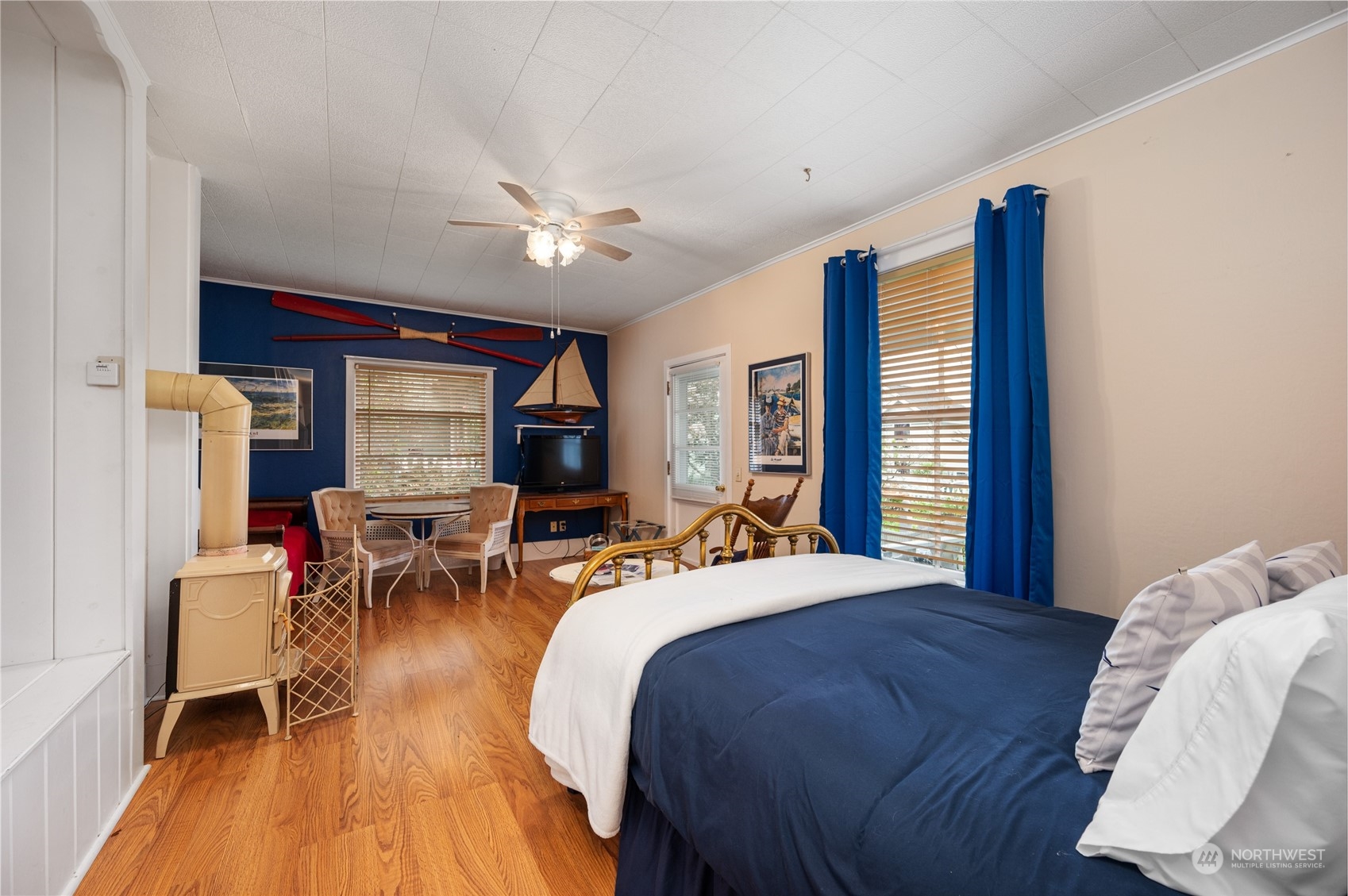 503 South 3rd Street La Conner, WA 98257 - Photo 12 of 39 a bedroom with a bed large window table and chair