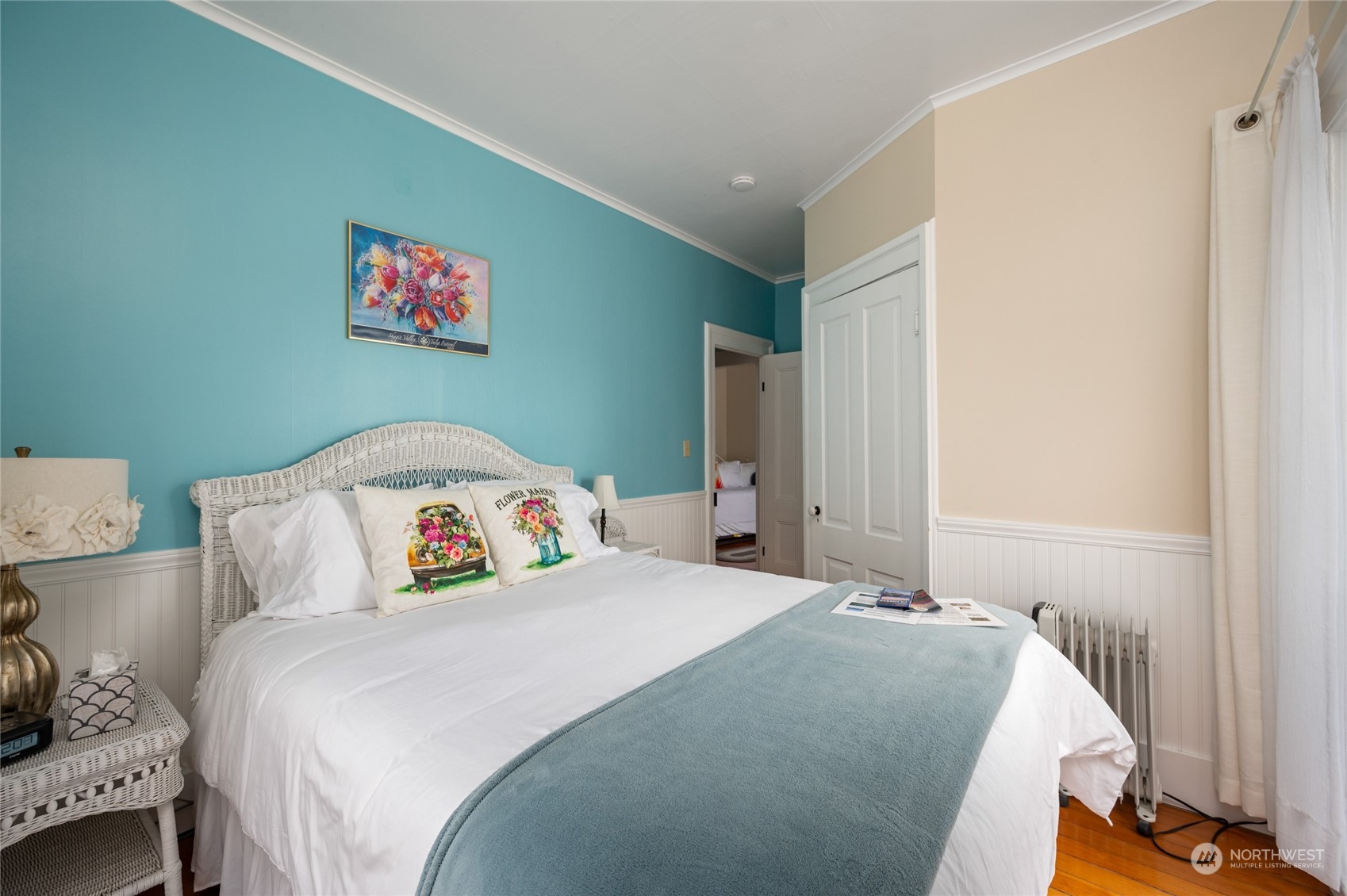 503 South 3rd Street La Conner, WA 98257 - Photo 22 of 39 a bedroom with a bed and a painting on the wall