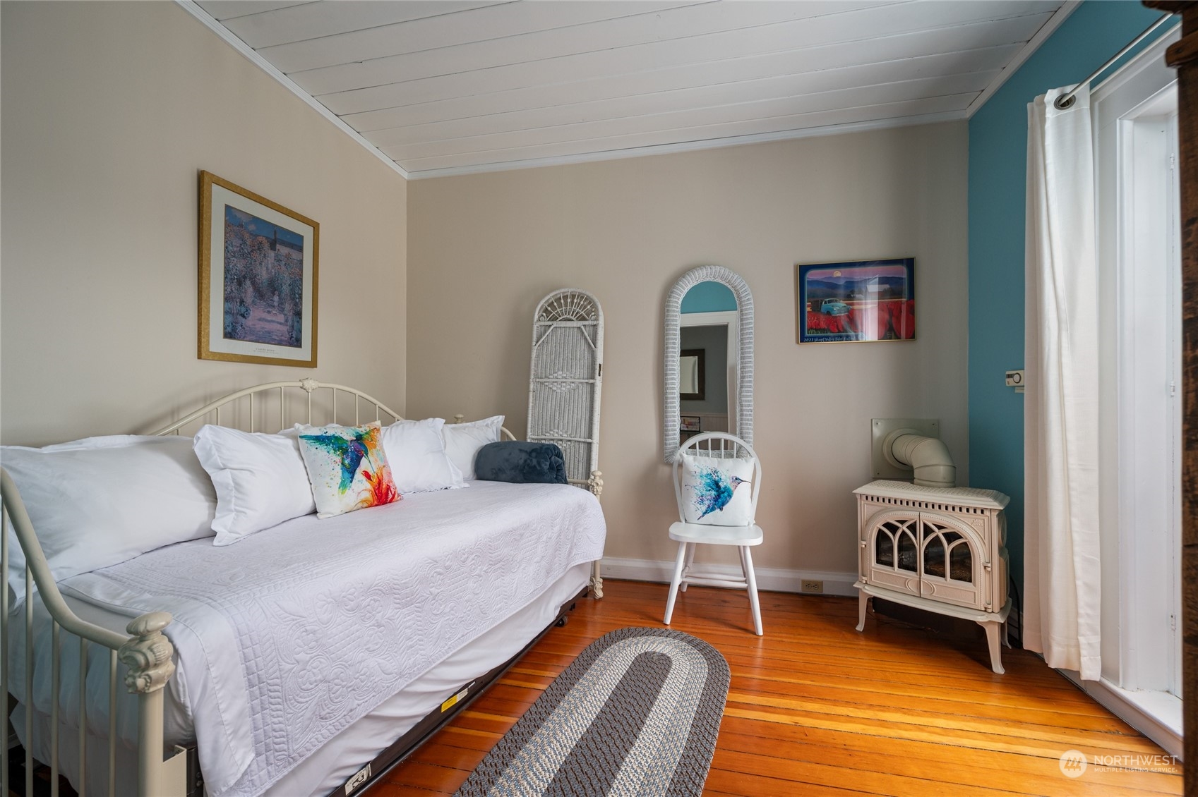 503 South 3rd Street La Conner, WA 98257 - Photo 24 of 39 a bedroom with a bed and a chair