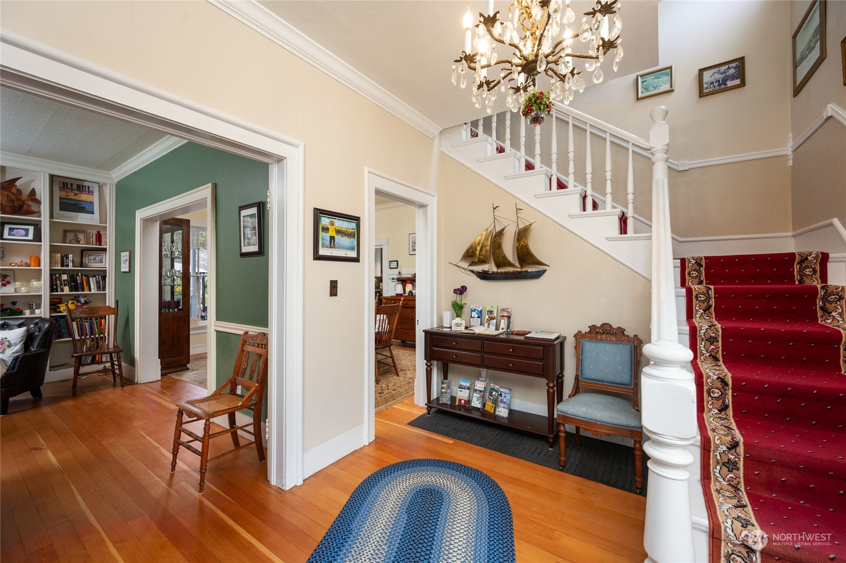 503 South 3rd Street La Conner, WA 98257 - Photo 4 of 39 a living room with furniture stairs and a chandelier