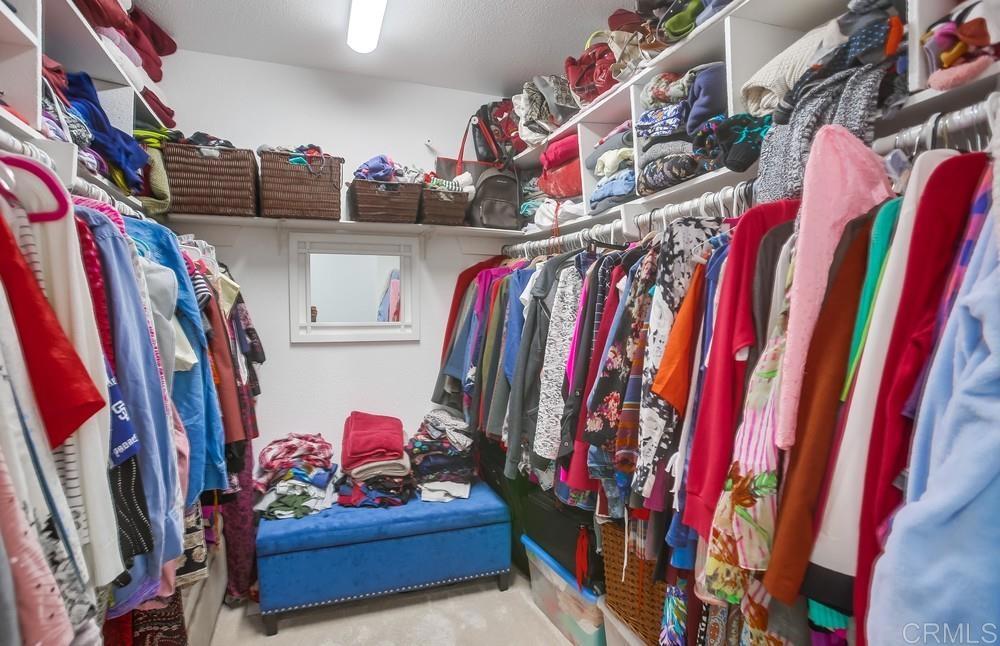 12705 Coachman Court Poway, CA 92064 - Photo 15 of 29 a view of walk in closet with clothes and shoes