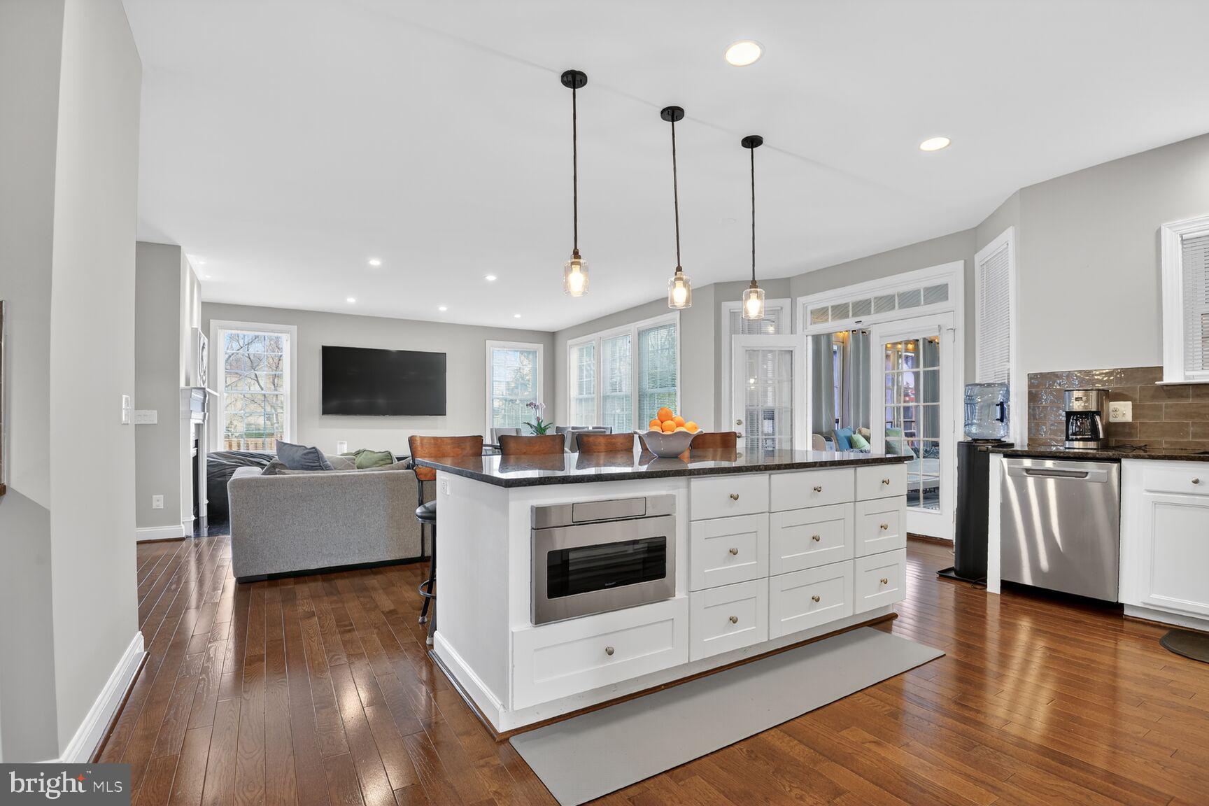 8808 Talbert Road Lorton, VA 22079 - Photo 13 of 52 a view of living room kitchen with stainless steel appliances granite countertop living room